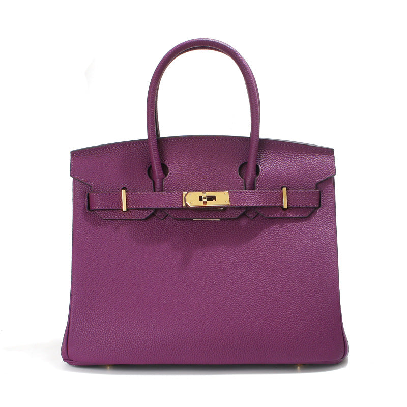 Birk-Handtasche aus Narbenleder mit goldenen Beschlägen