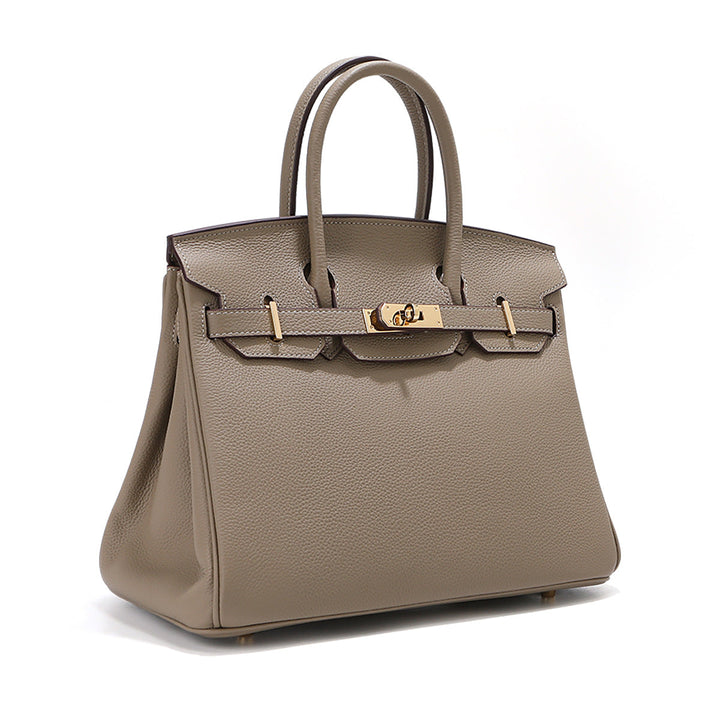 Birk-Handtasche aus Narbenleder mit goldenen Beschlägen