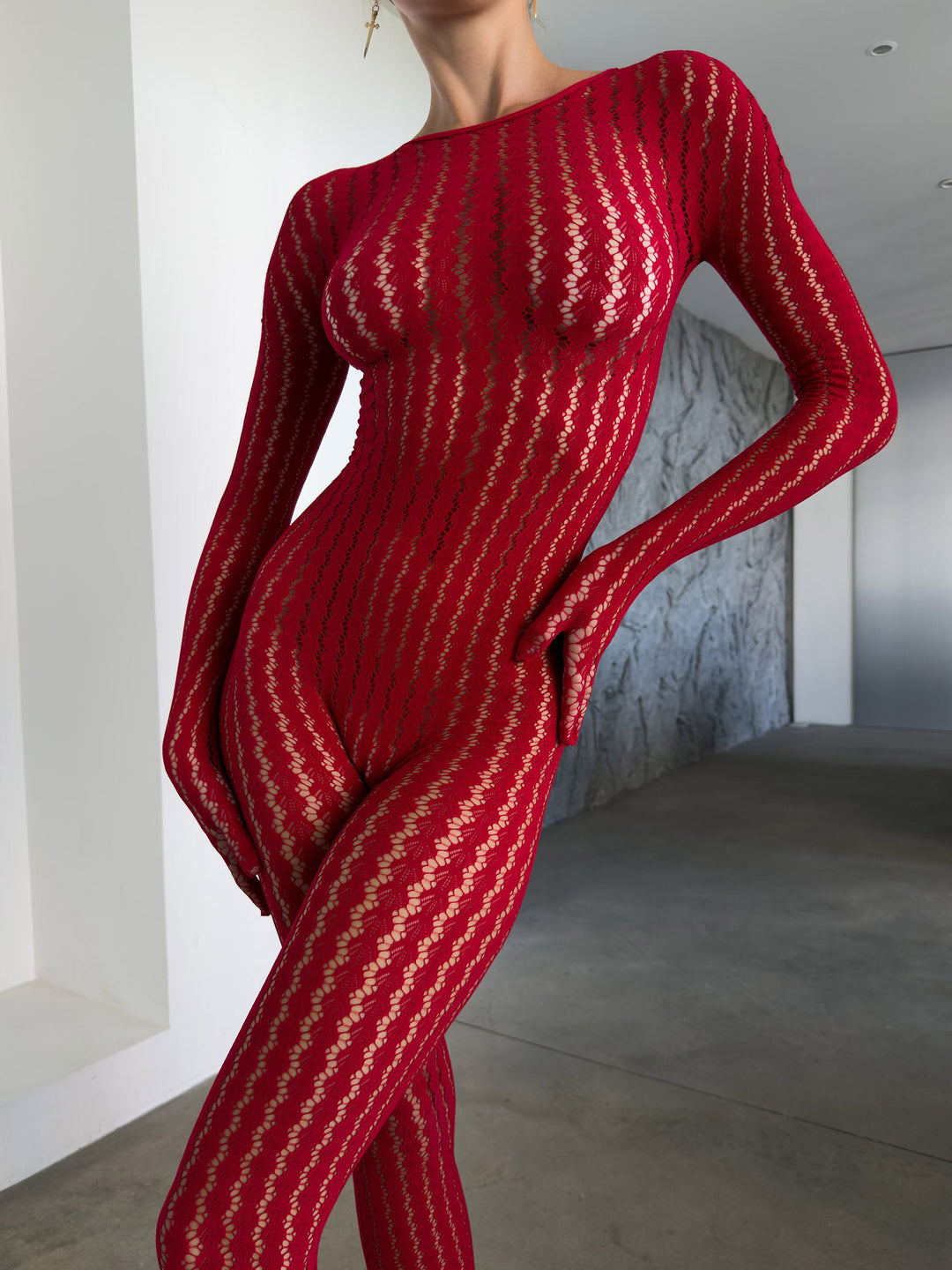 Transparenter Catsuit mit Ajour-Muster und langen Ärmeln in Schwarz