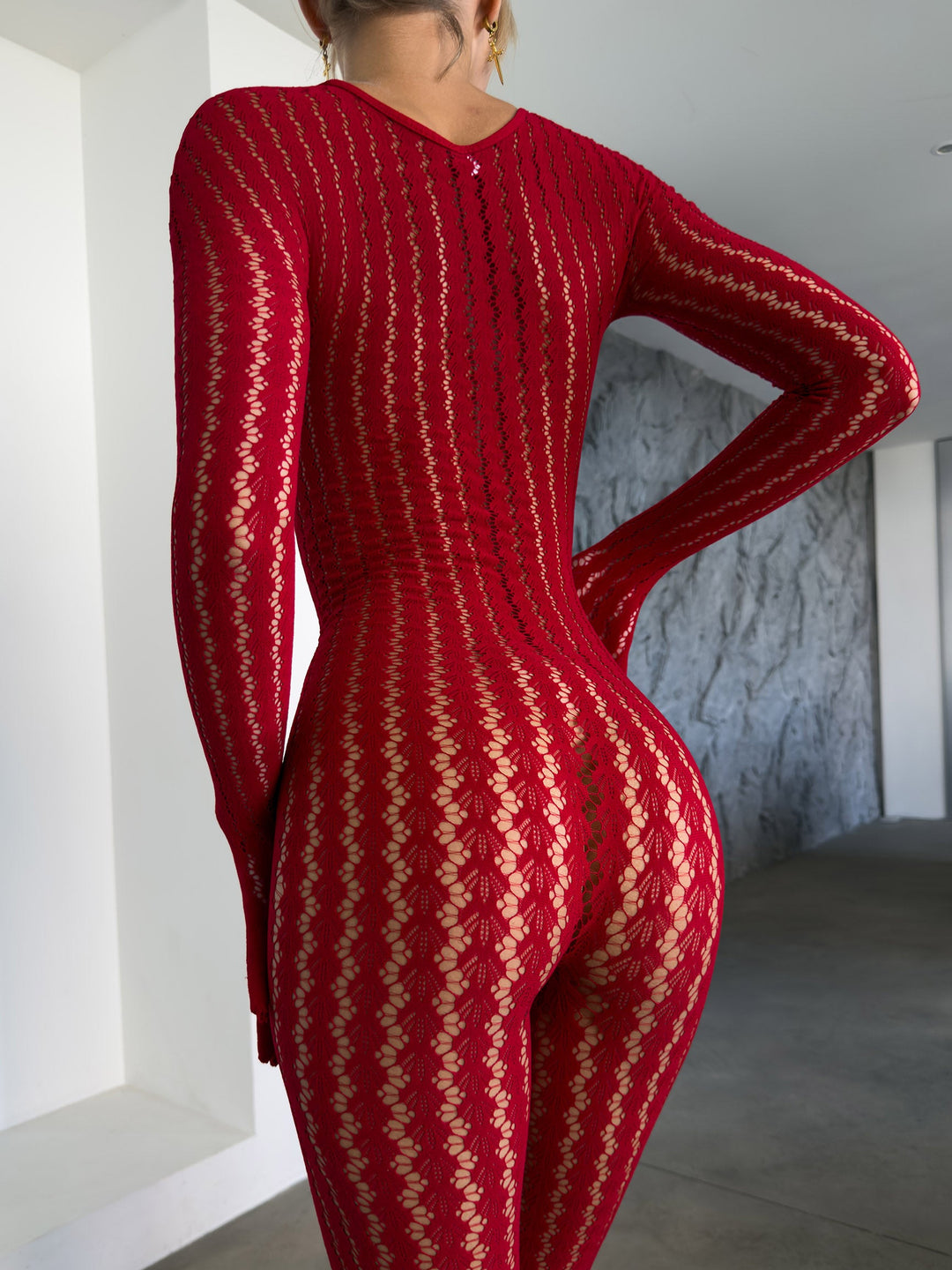 Transparenter Catsuit mit Ajour-Muster und langen Ärmeln in Schwarz