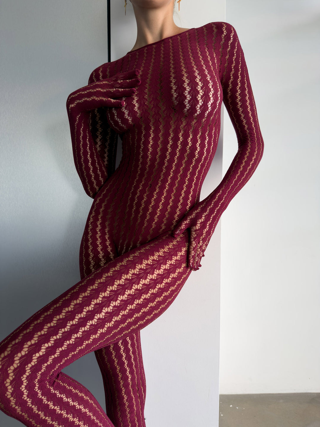 Transparenter Catsuit mit Ajour-Muster und langen Ärmeln in Schwarz