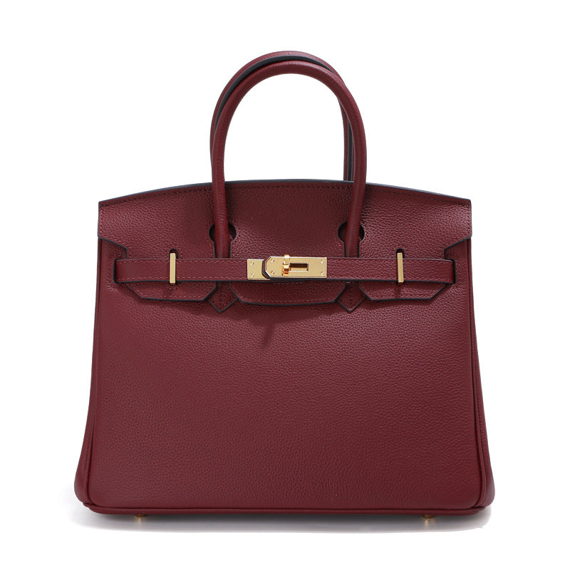Birk-Handtasche aus Togo-Narbenleder mit goldenen Beschlägen und Drehverschluss