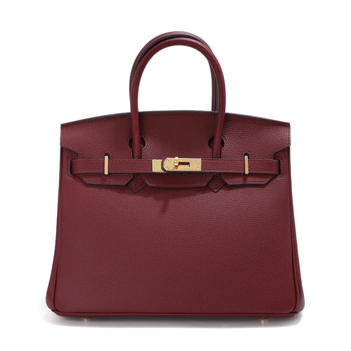 Birk-Handtasche aus Togo-Narbenleder mit goldenen Beschlägen und Drehverschluss
