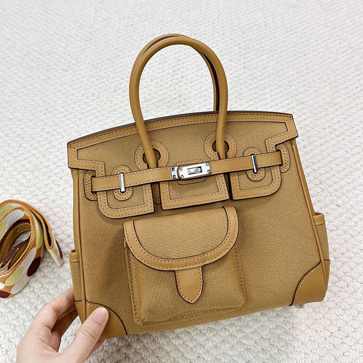 Pocket Birk-Handtasche aus Canvas und Narbenleder mit Seitenfächern und abnehmbarem Riemen