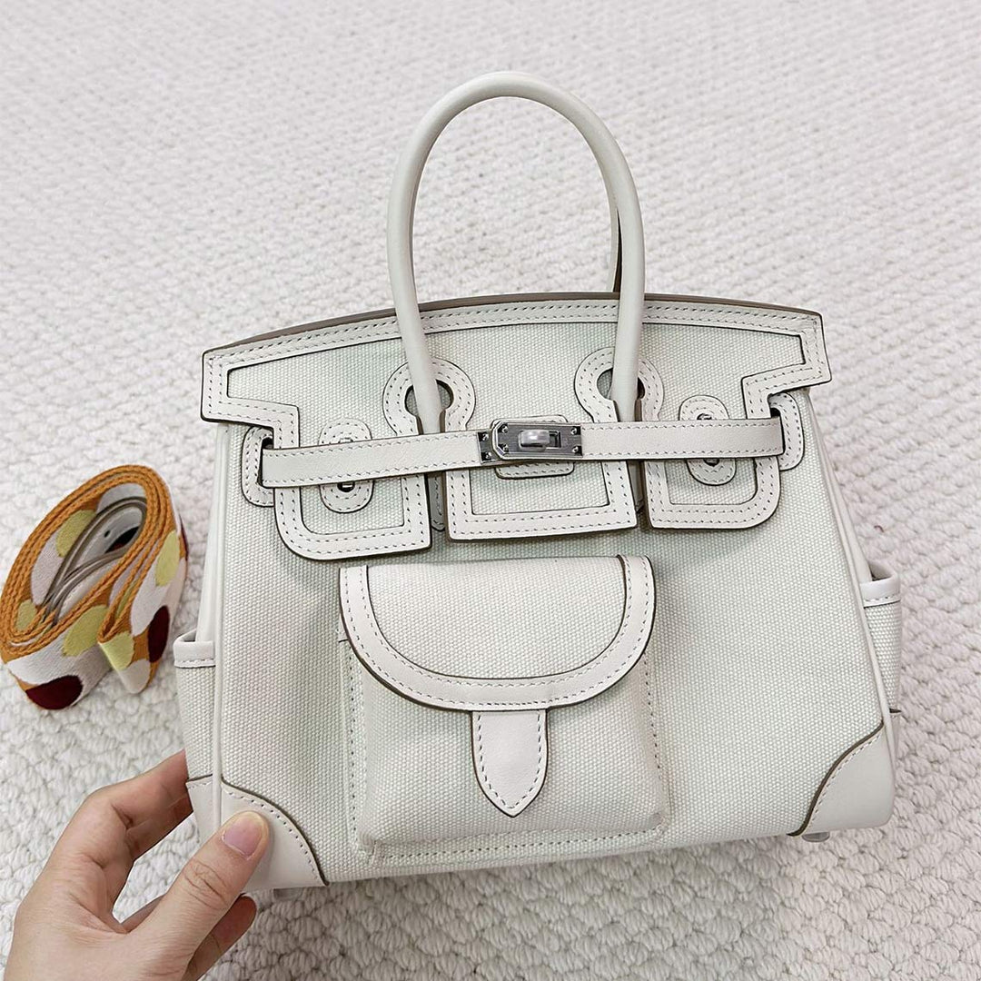 Pocket Birk-Handtasche aus Canvas und Narbenleder mit Seitenfächern und abnehmbarem Riemen