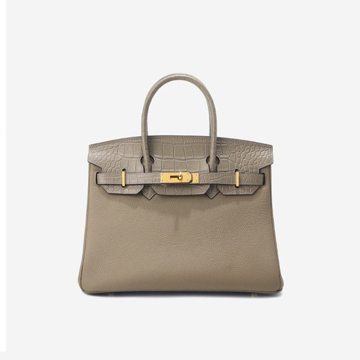 New Birk-Handtasche aus Narbenleder mit Kroko-Klappe und goldfarbenem Drehverschluss