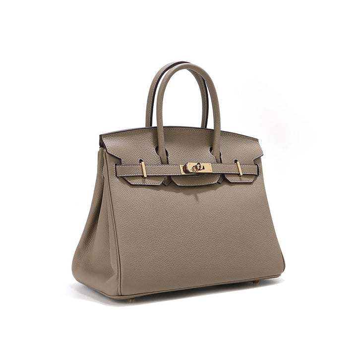 Birk Handtasche XL aus Narbenleder mit goldenem Drehverschluss und Rollhenkeln