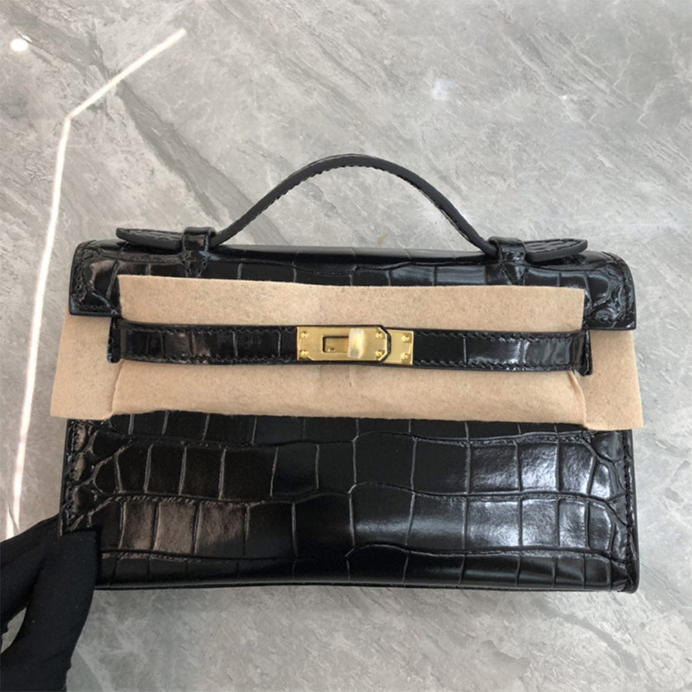 Kelli Clutch aus Leder mit Kroko-Prägung und Drehverschluss