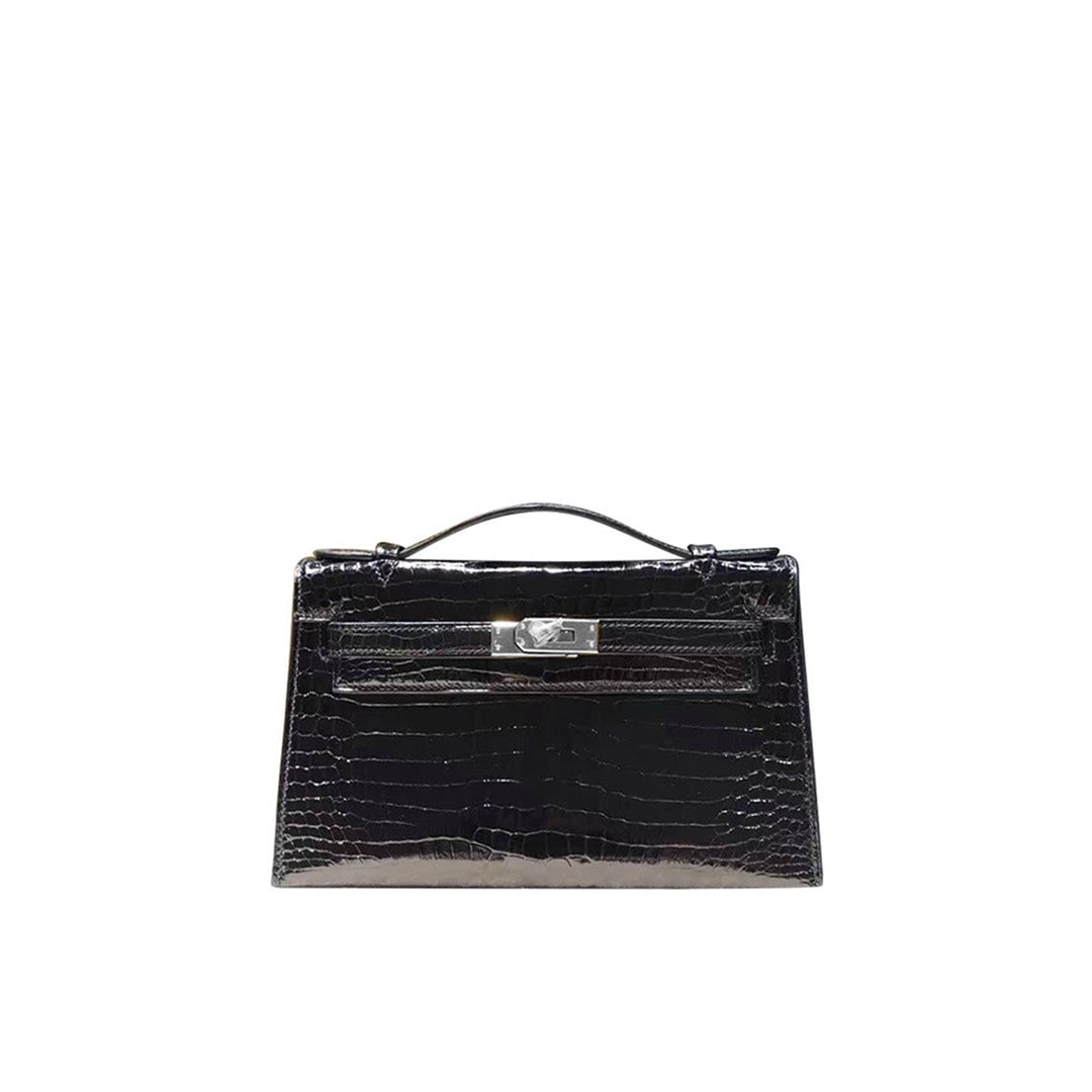 Kelli Clutch aus Leder mit Kroko-Prägung und Drehverschluss