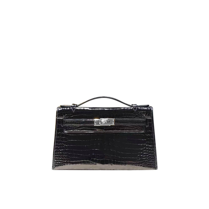 Kelli Clutch aus Leder mit Kroko-Prägung und Drehverschluss