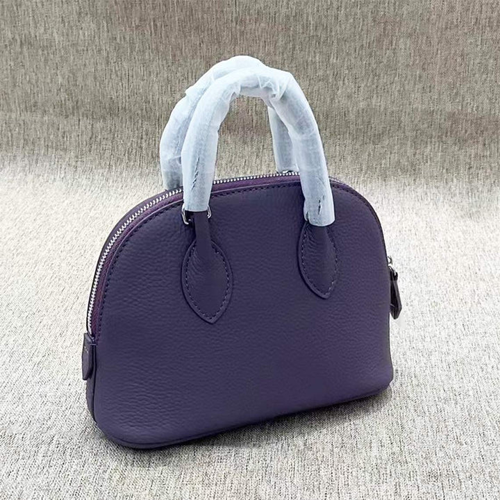 Mini Bowling-Handtasche aus Narbenleder mit silbernen Beschlägen