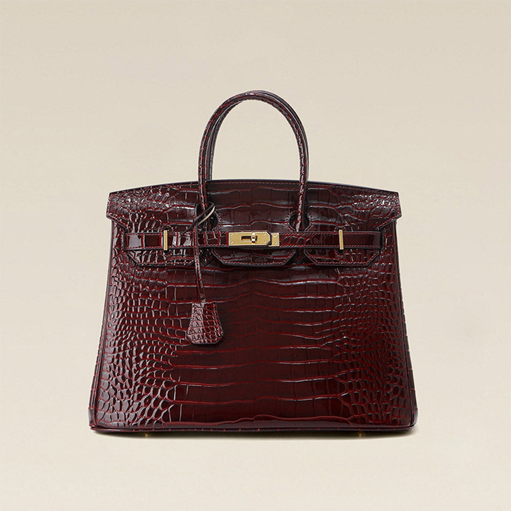 Birk-Handtasche aus Leder mit Kroko-Prägung in Rouge mit goldenem Drehverschluss