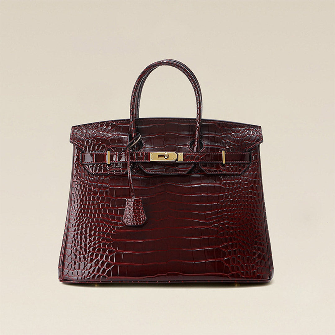 Birk-Handtasche aus Leder mit Kroko-Prägung in Rouge mit goldenem Drehverschluss