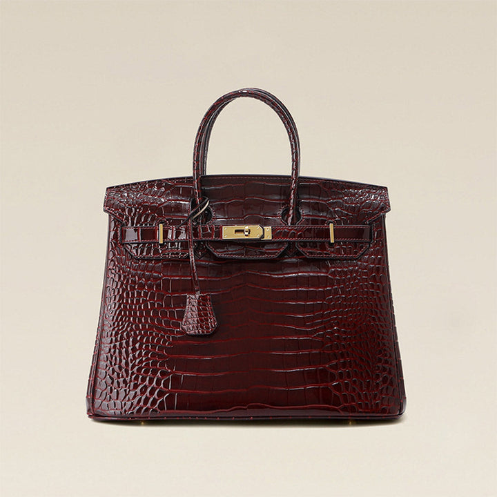 Birk-Handtasche aus Leder mit Kroko-Prägung in Rouge mit goldenem Drehverschluss