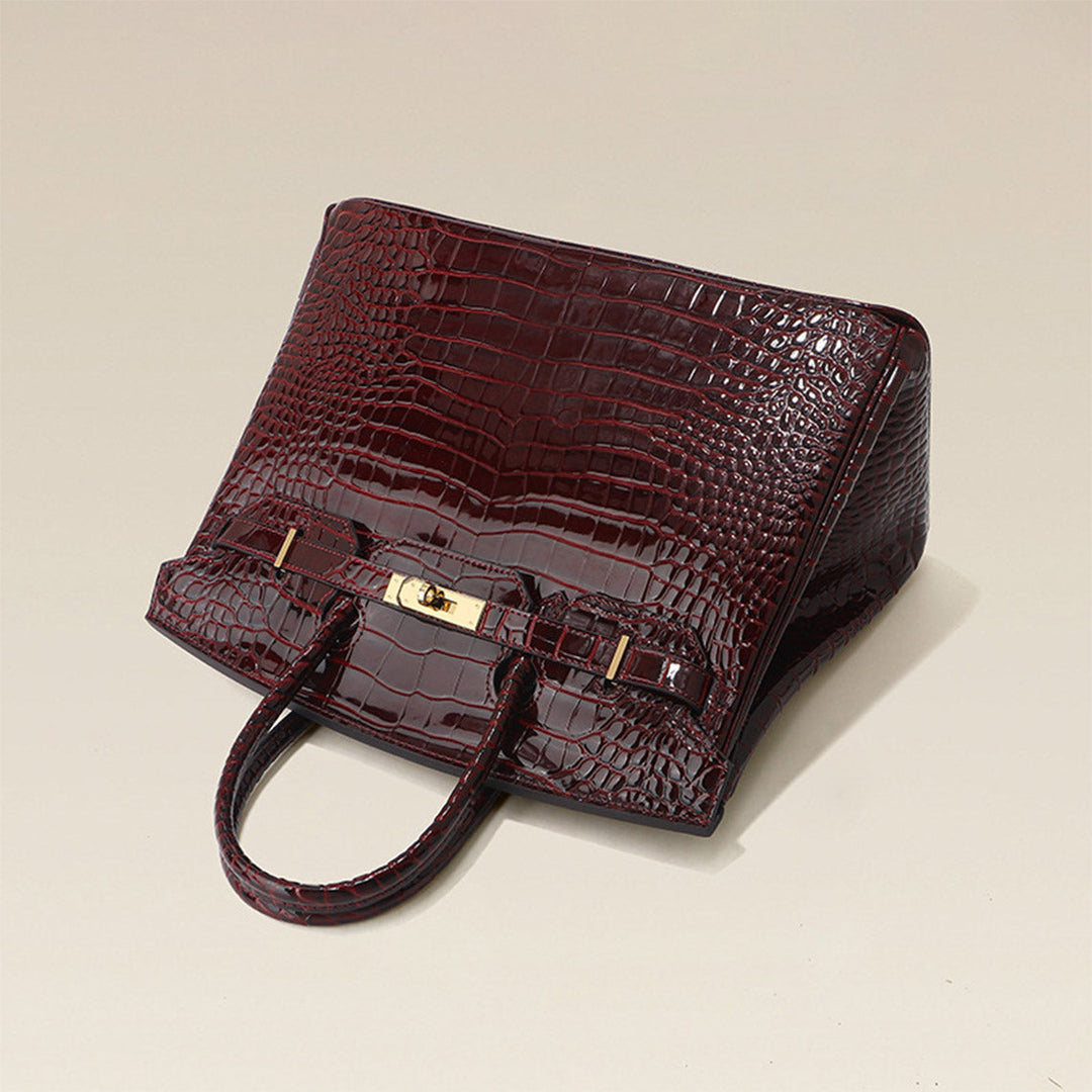 Birk-Handtasche aus Leder mit Kroko-Prägung in Rouge mit goldenem Drehverschluss