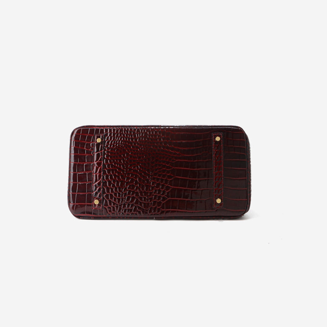 Birk-Handtasche aus Leder mit Kroko-Prägung in Rouge mit goldenem Drehverschluss