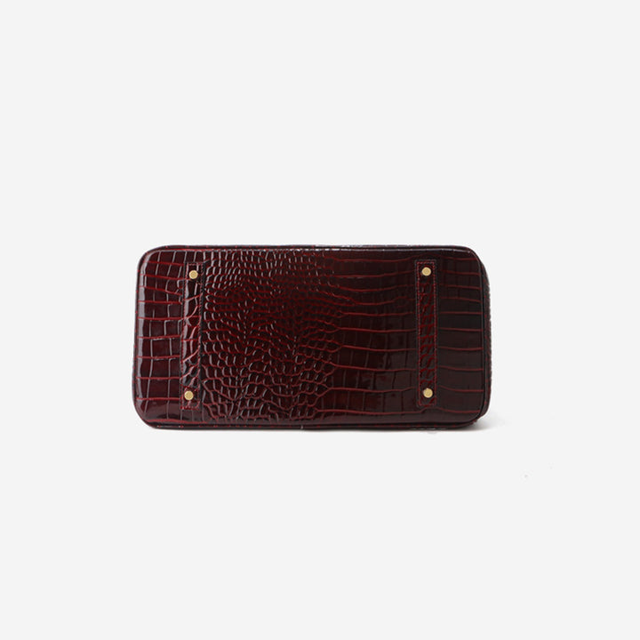 Birk-Handtasche aus Leder mit Kroko-Prägung in Rouge mit goldenem Drehverschluss