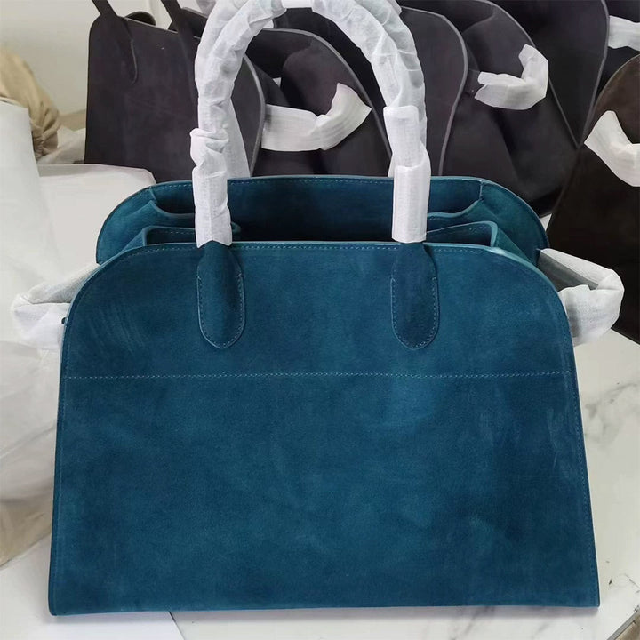 Margo Handtasche aus Wildleder mit Henkeln und goldfarbenen Beschlägen