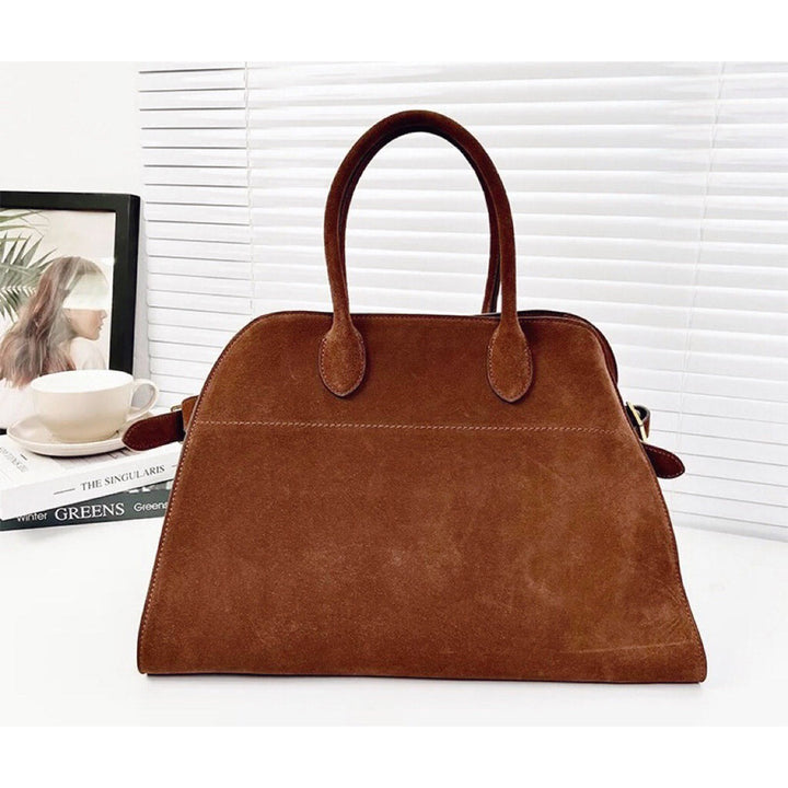 Margo Handtasche aus Wildleder mit Henkeln und goldfarbenen Beschlägen