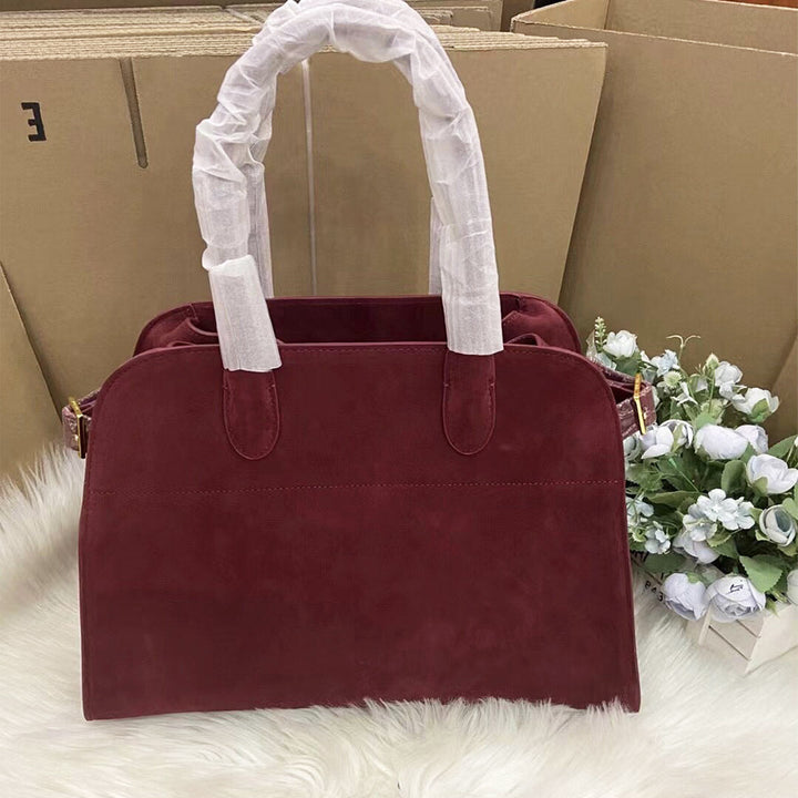 Margo Handtasche aus Wildleder mit Henkeln und goldfarbenen Beschlägen