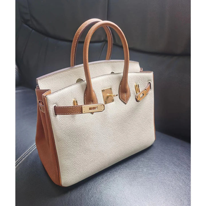 Birk-Handtasche aus Narbenleder mit goldenen Beschlägen