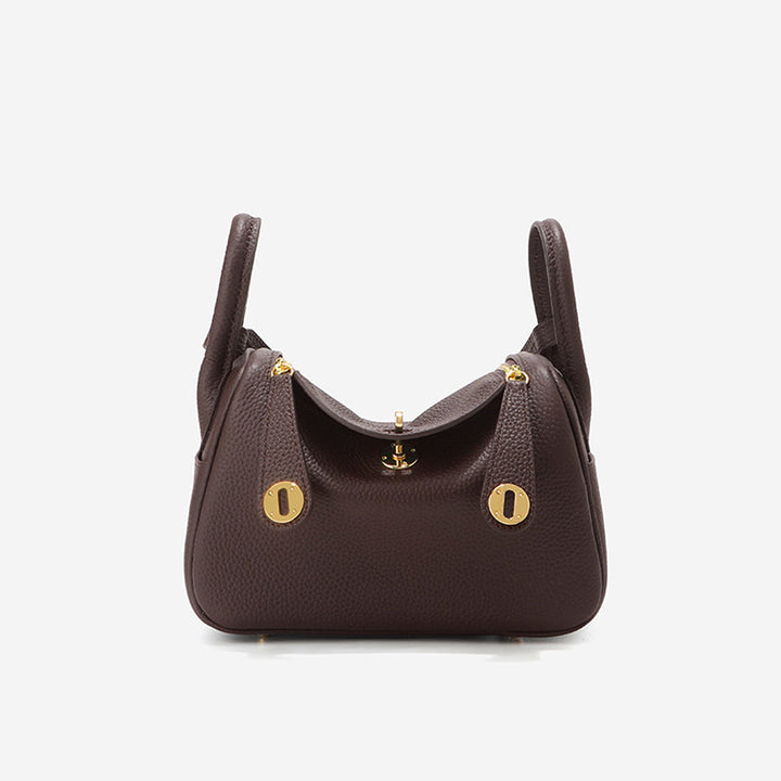 Lindi Tasche aus Narbenleder mit Henkeln und goldenen Beschlägen