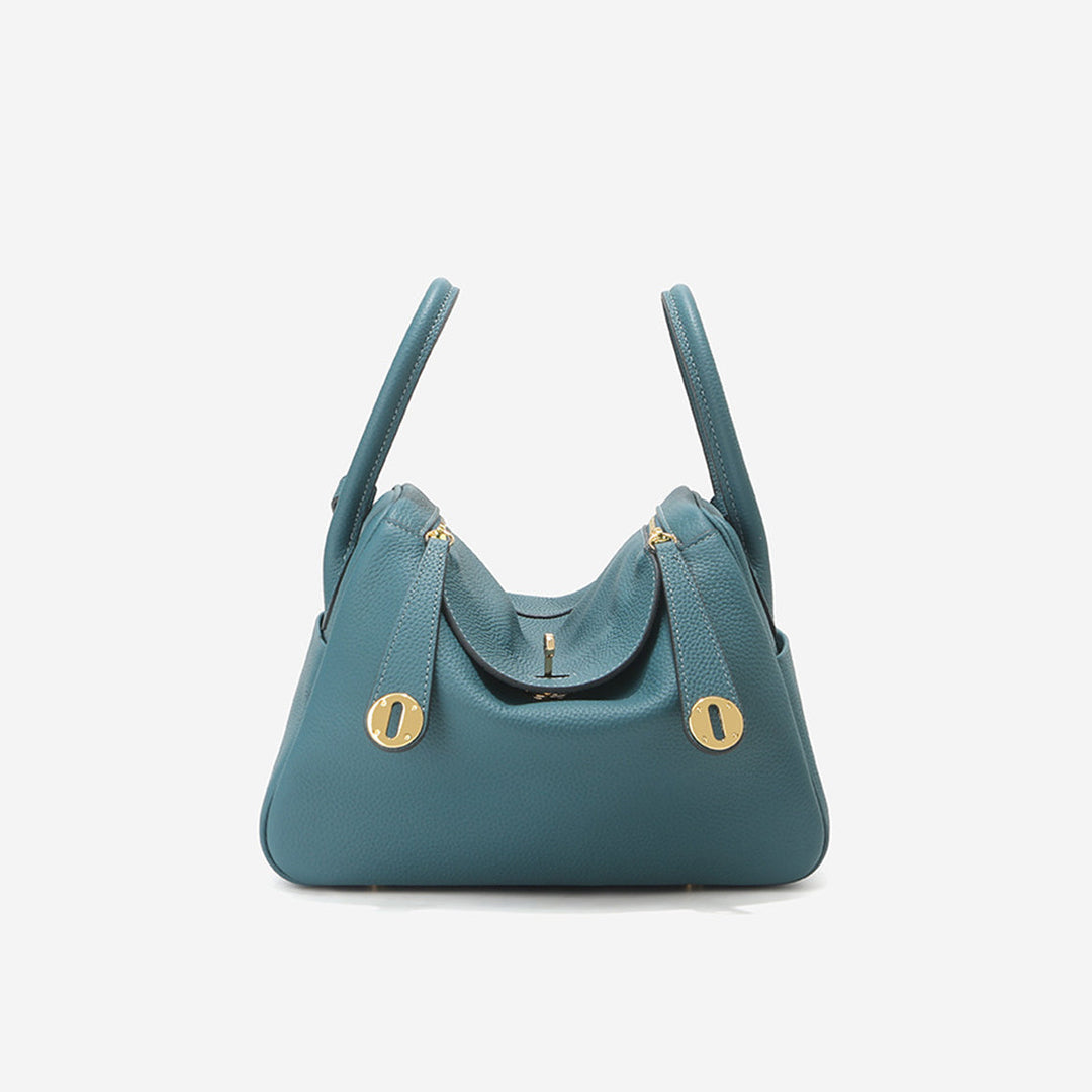 Lindi Tasche aus Narbenleder mit Henkeln und goldenen Beschlägen