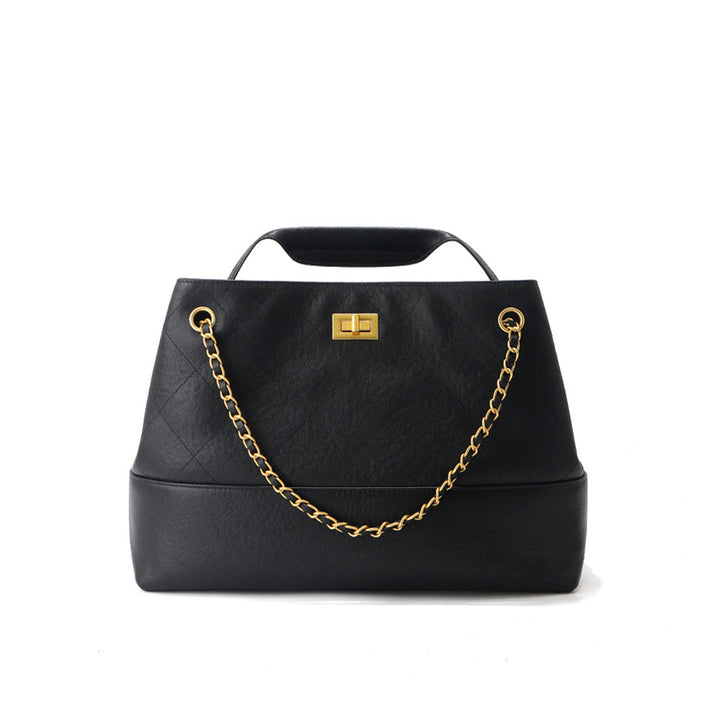 Gesteppte Schultertasche aus Wildleder mit goldfarbenen Beschlägen