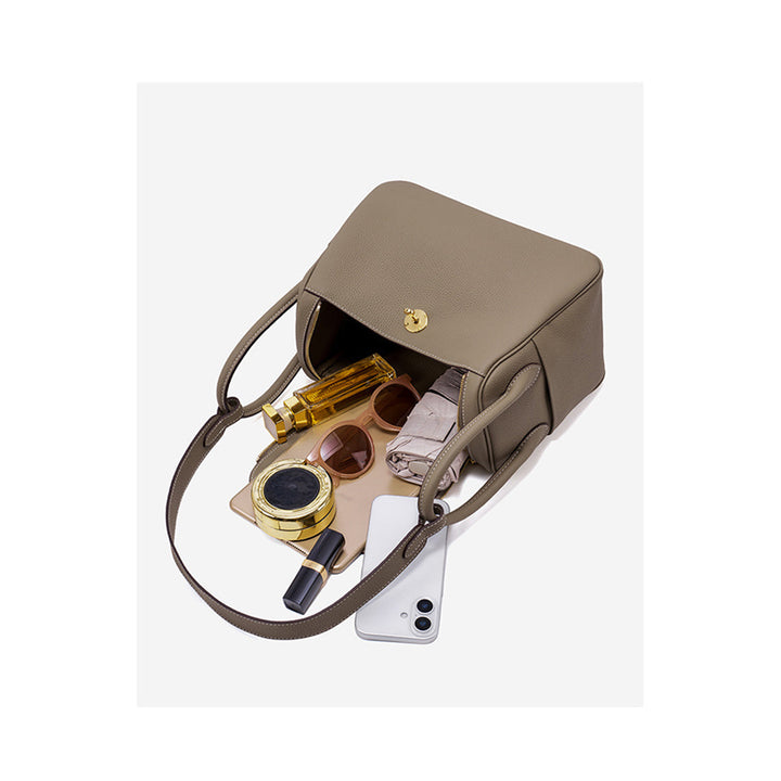 Lindi Tasche aus Narbenleder mit Henkeln und goldenen Beschlägen